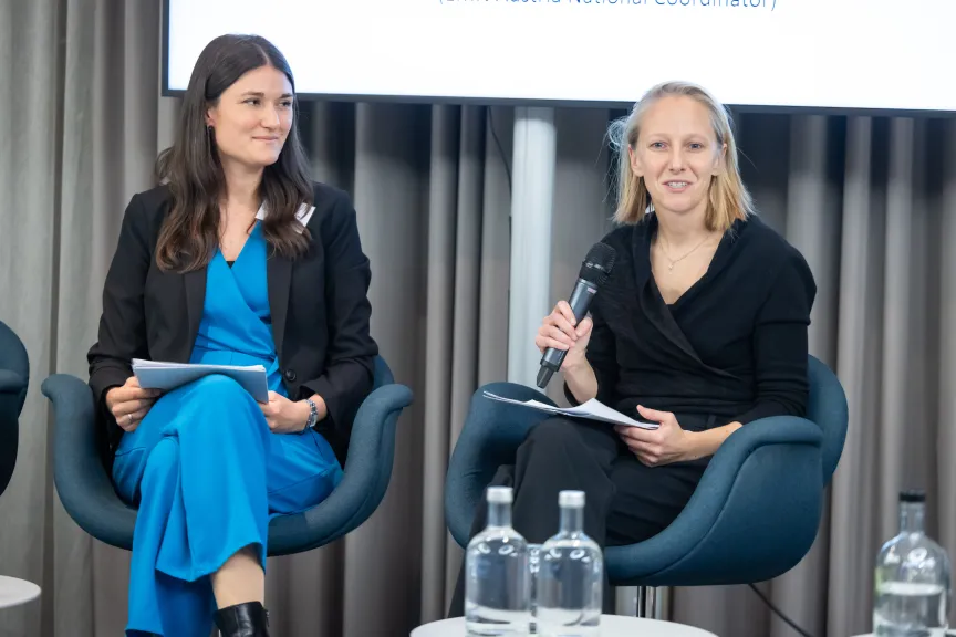 EMN-Conference - picture of Saskia Heilemann and Bettina Baumgartner on stage for closing remarks 